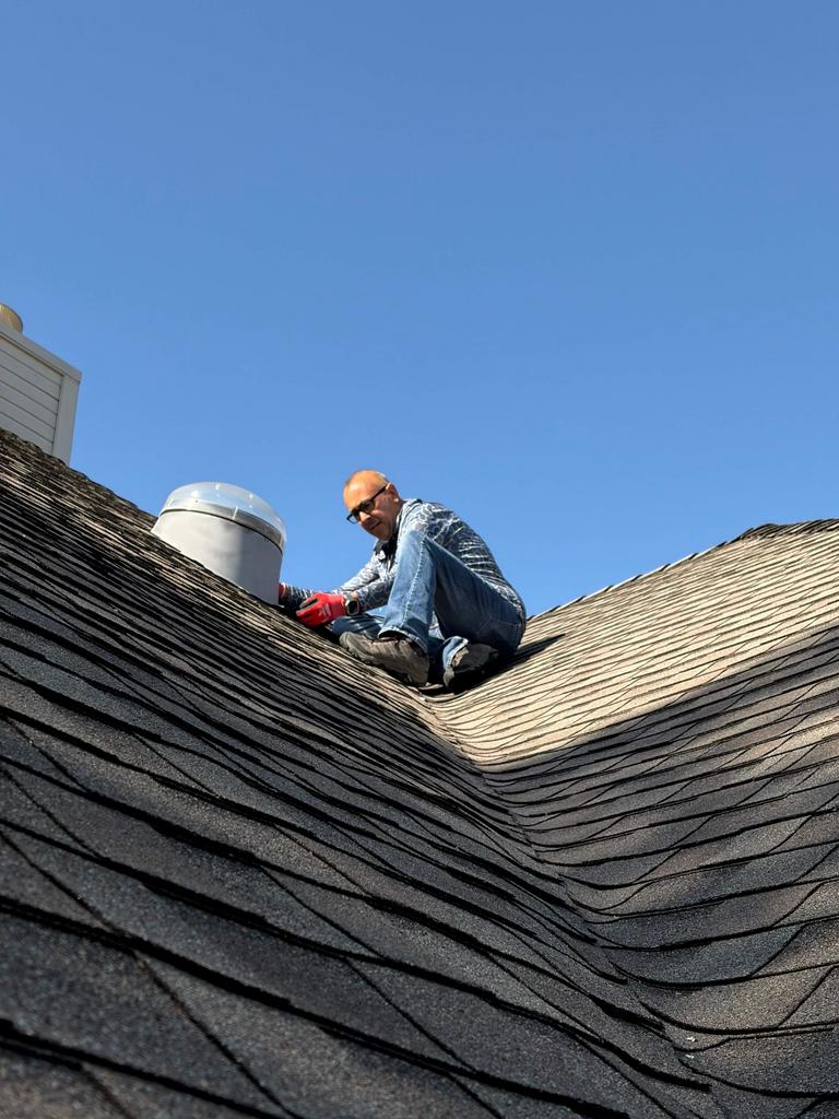 Exclusion work sealing areas on a roof near a vent in McKinney, Texas.
