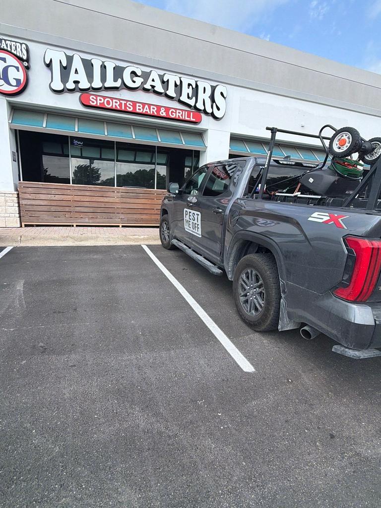 Pest Me Off service truck outside a sports bar and grill during a commercial general pest prevention visit in McKinney, Texas.