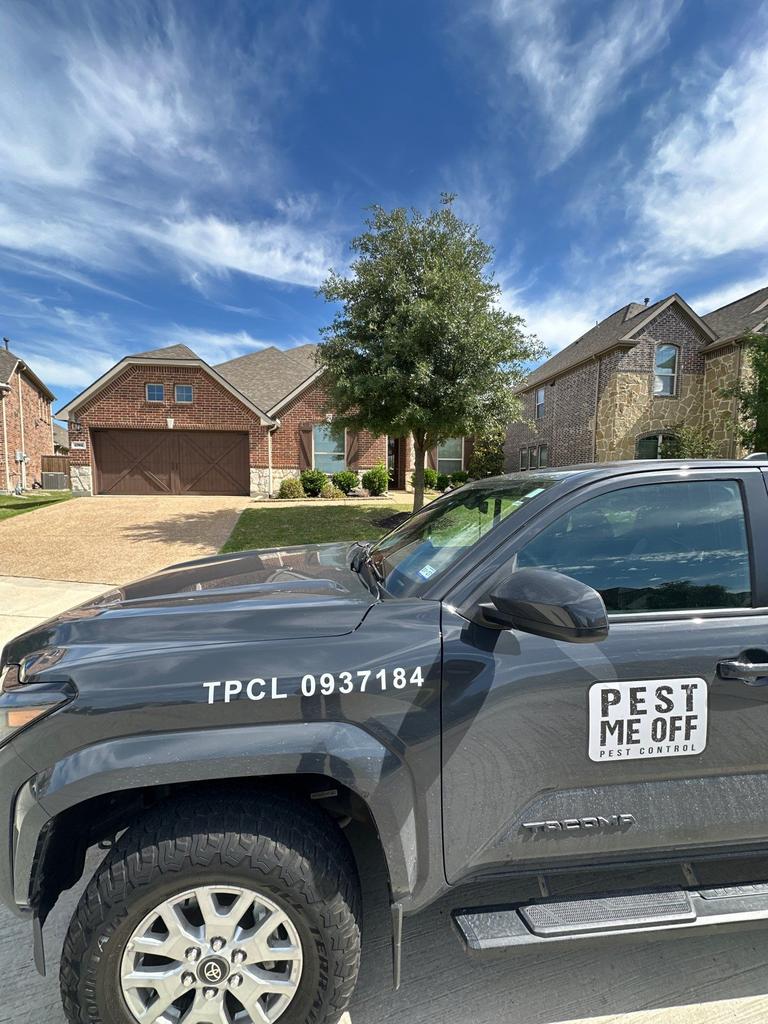 Pest Me Off service truck parked in front of a residential home, indicating a general pest control visit in Prosper, Texas.